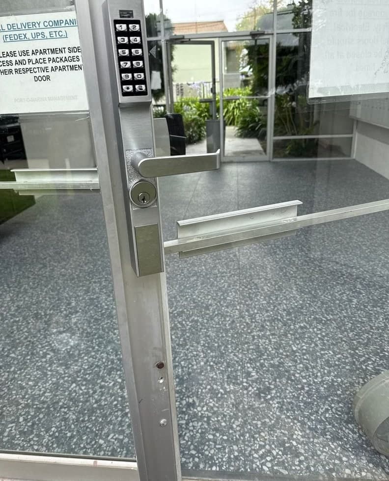 Before and after: the lock cylinder taken out of an aluminum glass door stile during the install, then a keypad lever trim and cylinder mounted in its place.
