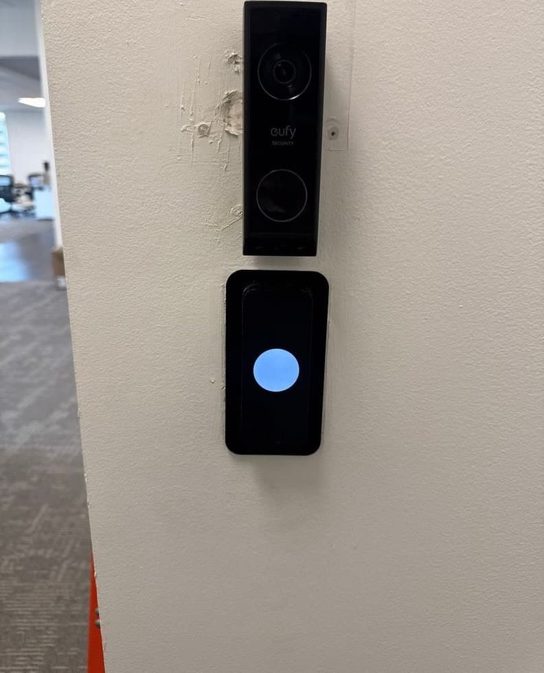Before and after: loose cables and a small wall plate, then a Kisi reader with a video doorbell mounted above it.