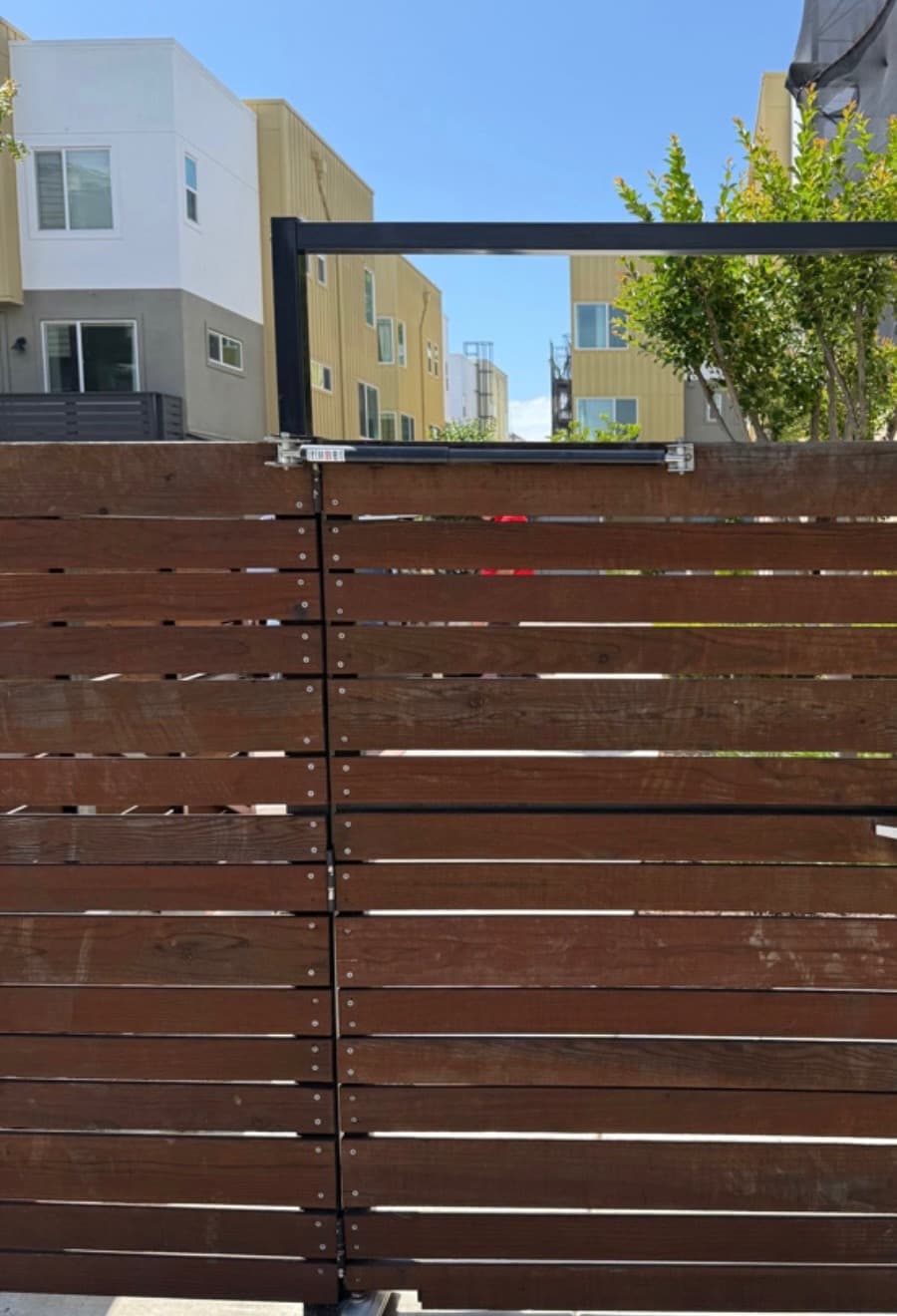 Gate access and intercom equipment at a multifamily entry.