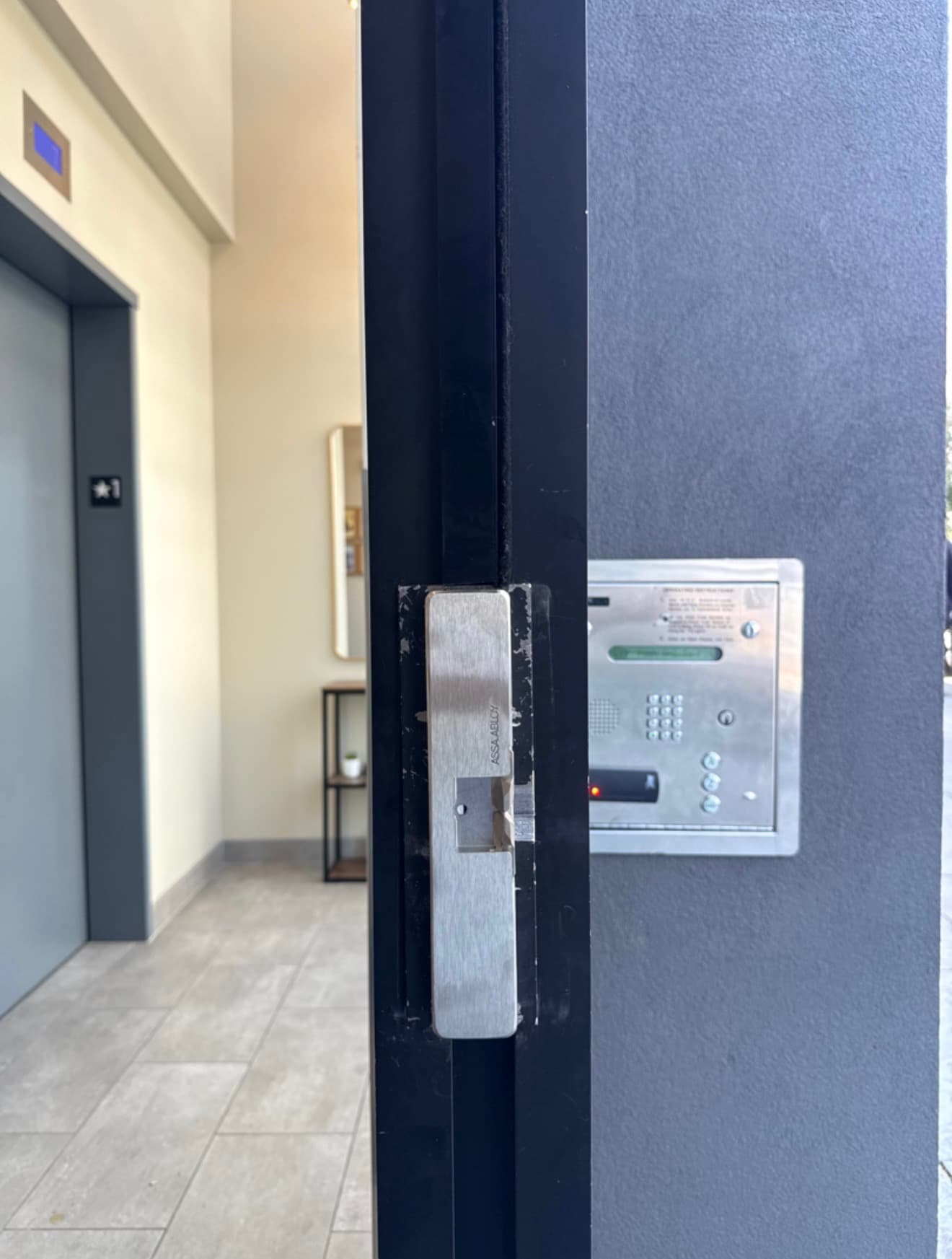 Close view of an electric strike and door-frame hardware at an access-controlled opening.