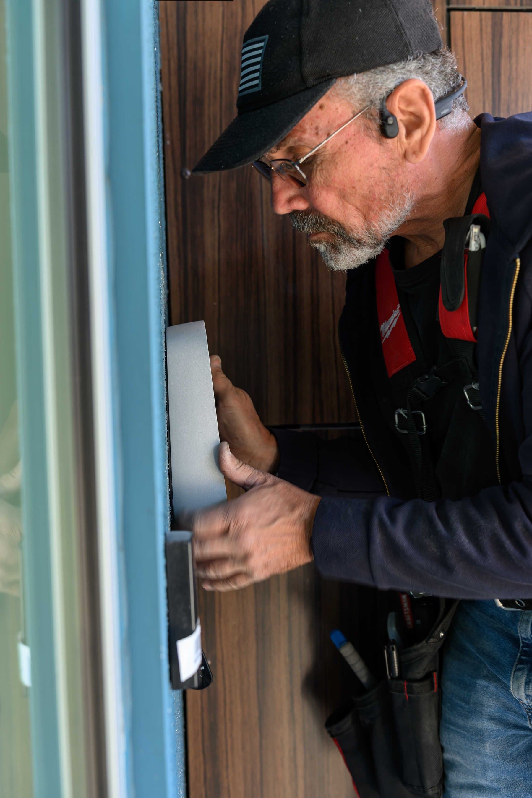 Elwin technician servicing entry hardware on a Bay Area commercial door.
