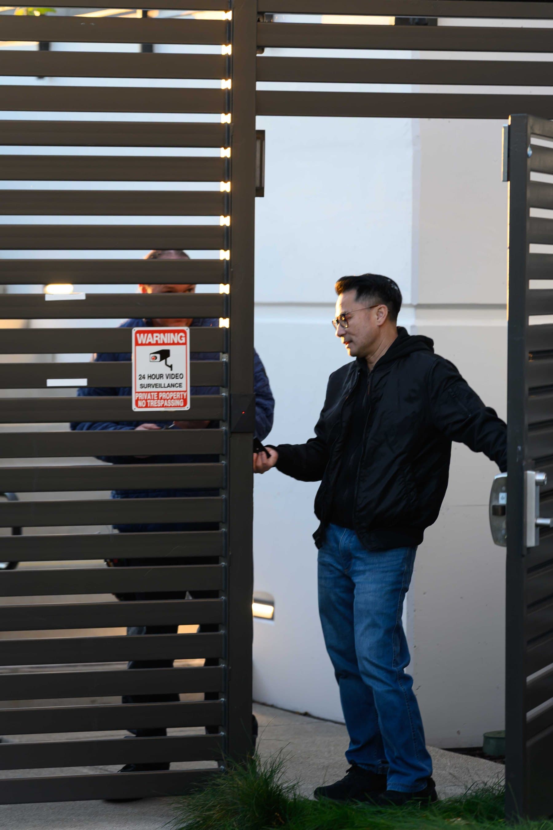 Elwin technician servicing release hardware at a Bay Area gate entry.